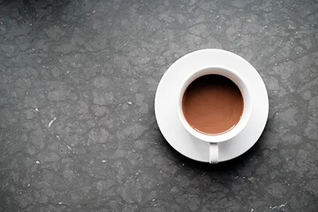 cup of tea on grey background